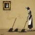 Banksy - Sweeping It Under the Carpet (2006)